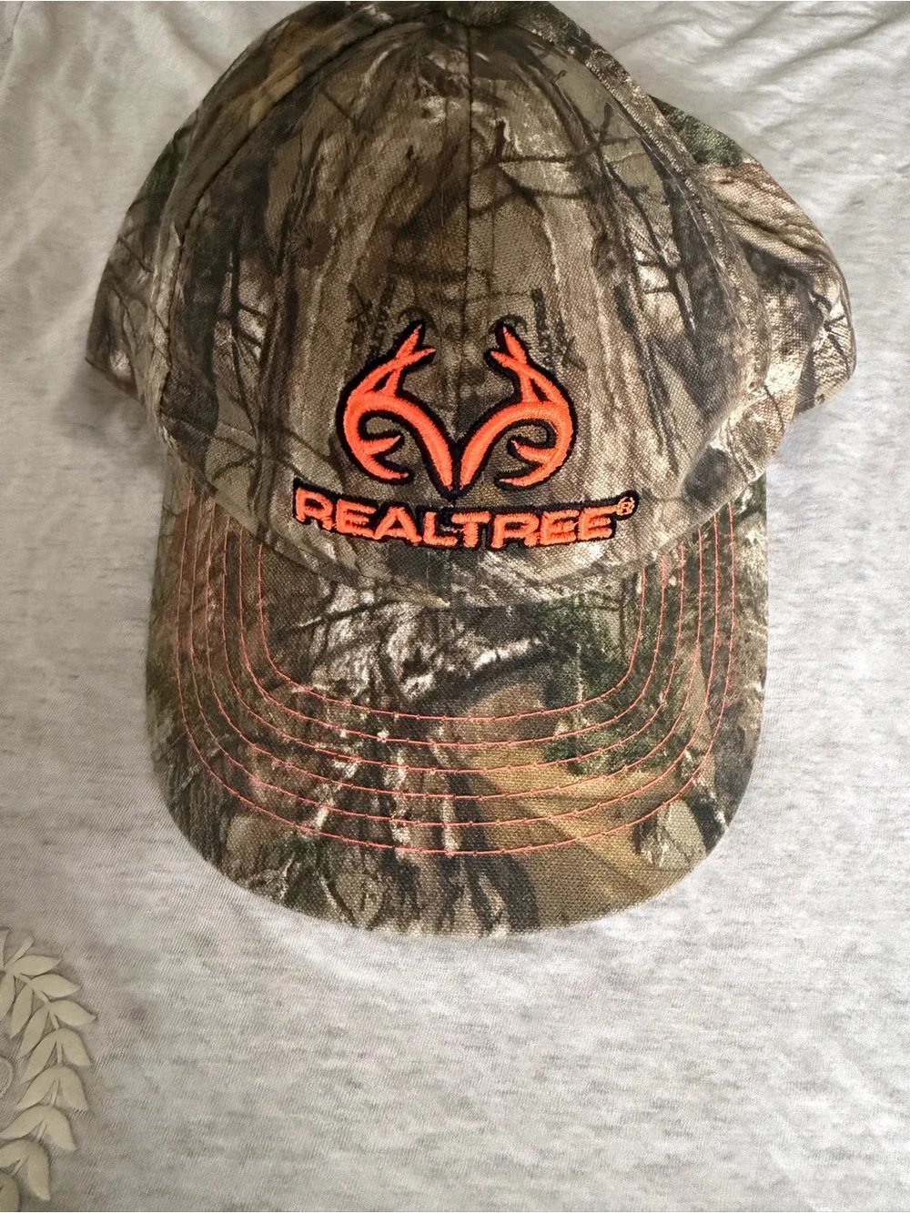 Realtree Camo Hat with Bright Orange Logo